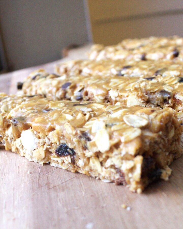 A wood table holding homemade granola bars.